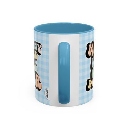 Perfect gift for mom. A decorative, 11oz ceramic mug. It’s wrapped in a light blue-white checkered background. In a happy and colorful 70s retro-style font it says Mommy Loves Girl Power, on both sides. 