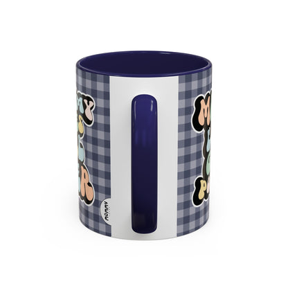 Perfect gift for mom. A decorative, 11oz ceramic mug. It’s wrapped in a navy blue-white checkered background. In a happy and colorful 70s retro-style font it says Mommy Loves Girl Power, on both sides. 