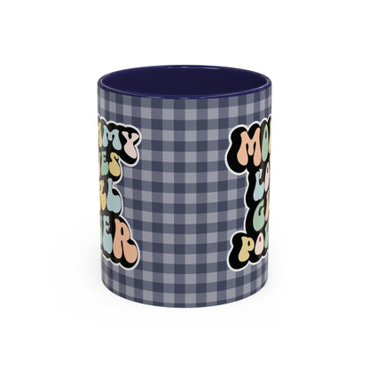 Perfect gift for mom. A decorative, 11oz ceramic mug. It’s wrapped in a navy blue-white checkered background. In a happy and colorful 70s retro-style font it says Mommy Loves Girl Power, on both sides. 
