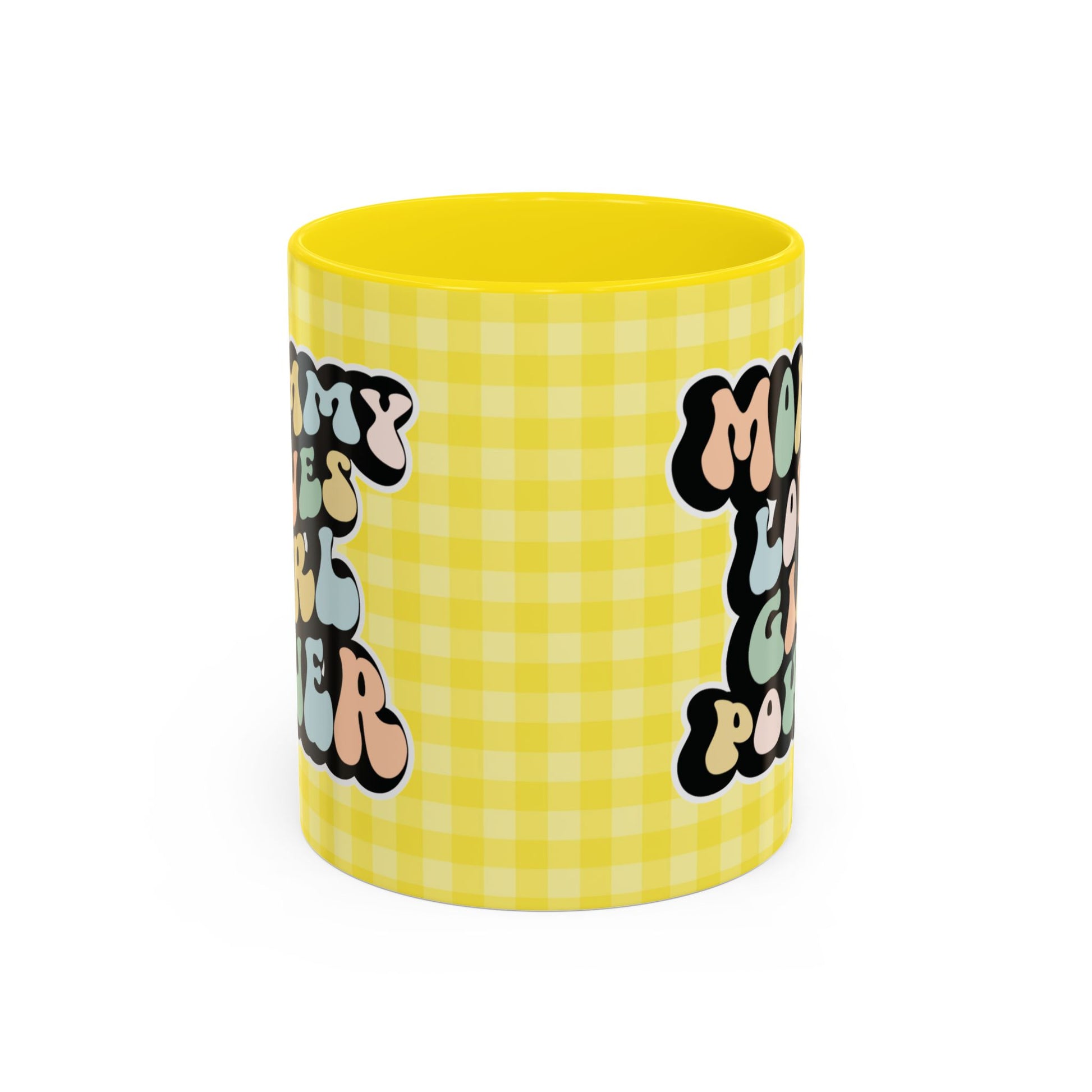 Perfect gift for mom. A decorative, 11oz ceramic mug. It’s wrapped in a yellow-white checkered background. In a happy and colorful 70s retro-style font it says Mommy Loves Girl Power, on both sides. 
