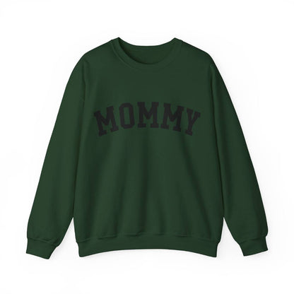 The perfect gift for mom. Our Mother’s Day special. Our crewneck sweatshirt. The color of the shirt is forest green, and in big black varsity letters it says MOMMY on the chest. It’s available in six sizes, ranging from S to 3XL. 