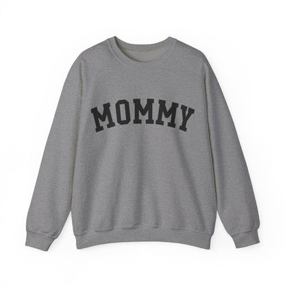 The perfect gift for mom. Our Mother’s Day special. Our crewneck sweatshirt. The color of the shirt is graphite heather, and in big black varsity letters it says MOMMY on the chest. It’s available in six sizes, ranging from S to 3XL. 