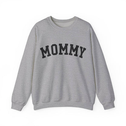 The perfect gift for mom. Our Mother’s Day special. Our crewneck sweatshirt. The color of the shirt is sport gray, and in big black varsity letters it says MOMMY on the chest. It’s available in six sizes, ranging from S to 3XL. 