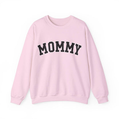 The perfect gift for mom. Our Mother’s Day special. Our crewneck sweatshirt. The color of the shirt is light pink, and in big varsity letters it says MOMMY on the chest. It’s available in six sizes, ranging from S to 3XL. 
