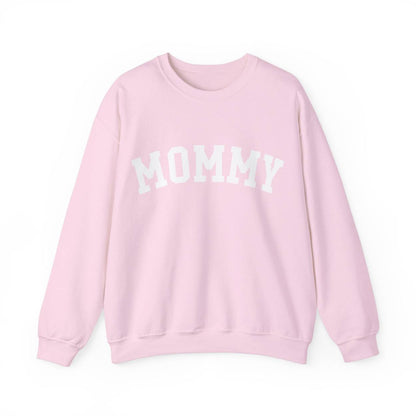 The perfect gift for mom. Our Mother’s Day special. Our crewneck sweatshirt. The color of the shirt is light pink, and in big white varsity letters it says MOMMY on the chest. It’s available in six sizes, ranging from S to 3XL. 