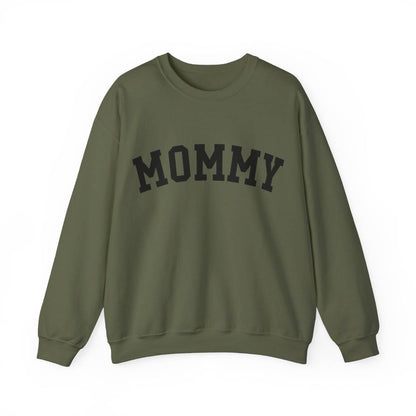 The perfect gift for mom. Our Mother’s Day special. Our crewneck sweatshirt. The color of the shirt is military green, and in big black varsity letters it says MOMMY on the chest. It’s available in six sizes, ranging from S to 3XL. 