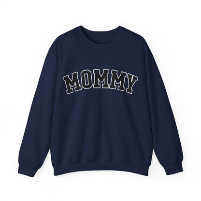 The perfect gift for mom. Our Mother’s Day special. Our crewneck sweatshirt. The color of the shirt is navy blue, and in big varsity letters it says MOMMY on the chest. It’s available in six sizes, ranging from S to 3XL. 