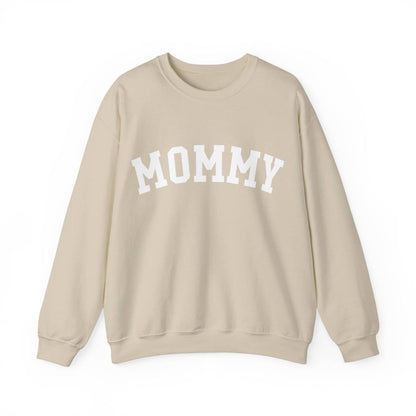 The perfect gift for mom. Our Mother’s Day special. Our crewneck sweatshirt. The color of the shirt is sand, and in big white varsity letters it says MOMMY on the chest. It’s available in six sizes, ranging from S to 3XL. 