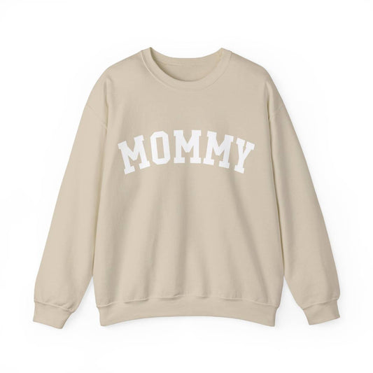 The perfect gift for mom. Our Mother’s Day special. Our crewneck sweatshirt. The color of the shirt is sand, and in big white varsity letters it says MOMMY on the chest. It’s available in six sizes, ranging from S to 3XL. 