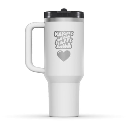 The back side of the newest Stanley 40oz Tumbler. The perfect gift for mom. The Color of the cup is Chalk, a shade of fresh white. It’s engraved with a typically 70s retro-style font, saying Mommy Loves Happy Hour. Under that text there is a nice big heart in the same retro style.