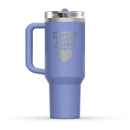 The back side of the newest Stanley 40oz Tumbler. The perfect gift for mom. The Color of the cup is Hydrangea, a shade of cyan blue. It’s engraved with a typically 70s retro-style font, saying Mommy Loves Hugs. Under that text there is a nice big heart in the same retro style.