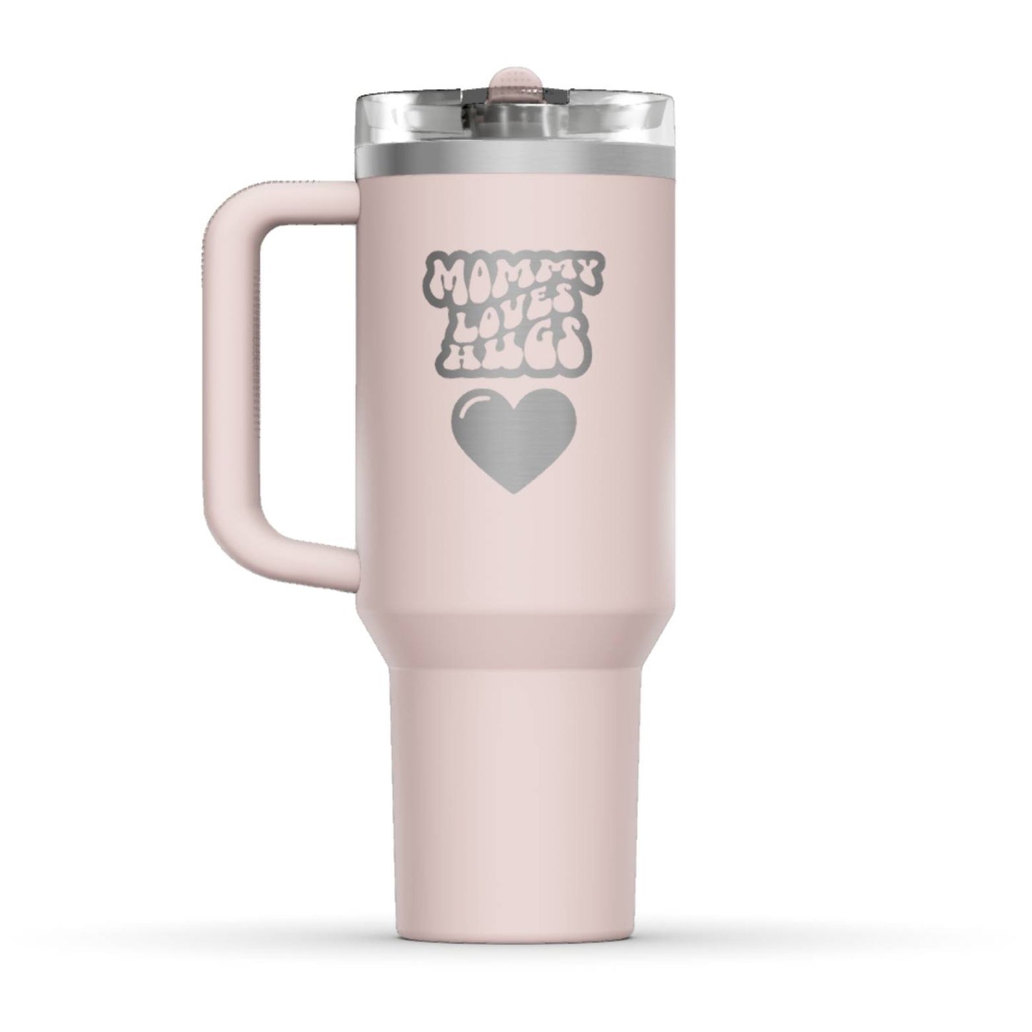 The back side of the newest Stanley 40oz Tumbler. The perfect gift for mom. The Color of the cup is Rose Quartz, a shade of soft pink. It’s engraved with a typically 70s retro-style font, saying Mommy Loves Hugs. Under that text there is a nice big heart in the same retro style.