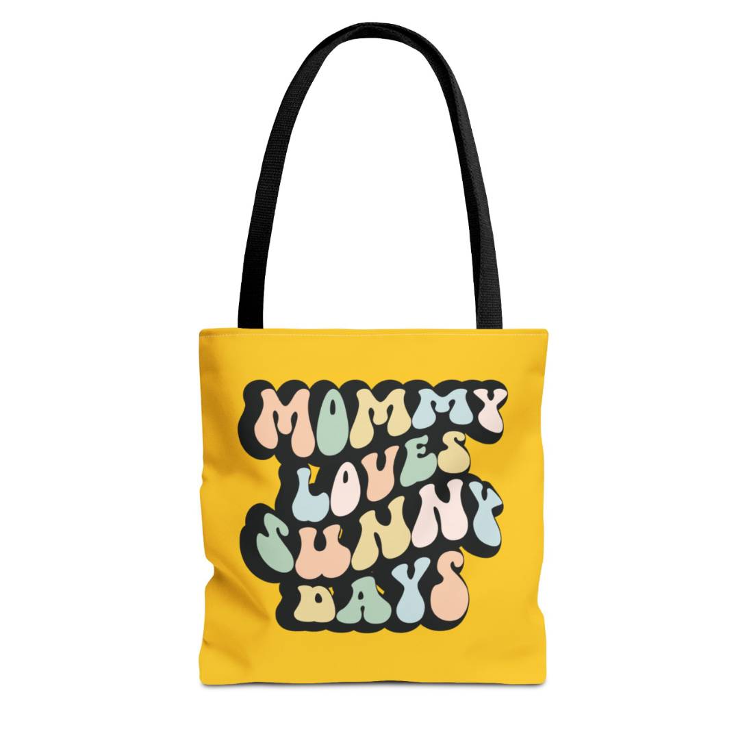 Perfect gift for mom. A mustard yellow tote bag, available in three sizes. In a typically 70s retro-style font, it says Mommy Loves Sunny Days. The handle is black.