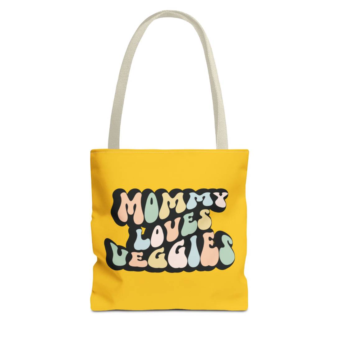Perfect gift for mom. A mustard yellow tote bag, available in three sizes. In a typically 70s retro-style font, it says Mommy Loves Veggies. The handle is beige.