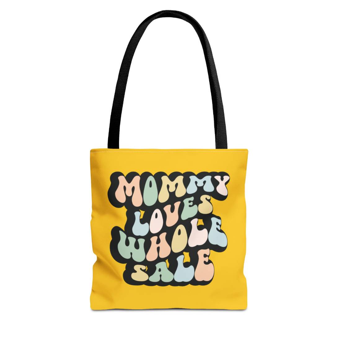 Perfect gift for mom. A mustard yellow tote bag, available in three sizes. In a typically 70s retro-style font, it says Mommy Loves Wholesale. 