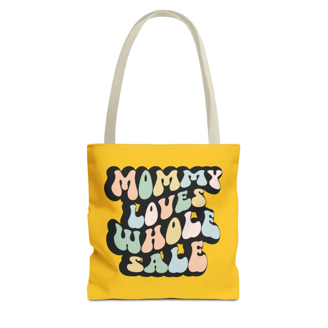 Perfect gift for mom. A mustard yellow tote bag, available in three sizes. In a typically 70s retro-style font, it says Mommy Loves Wholesale. 